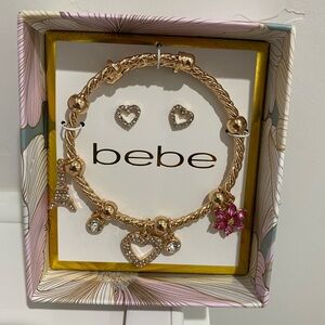 Bebe Gold Bracelet with Heart and Flower Charms